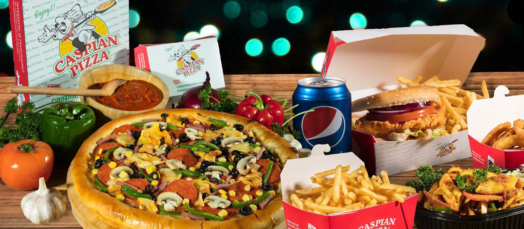 A spread of Caspian pizza and takeaway favourites