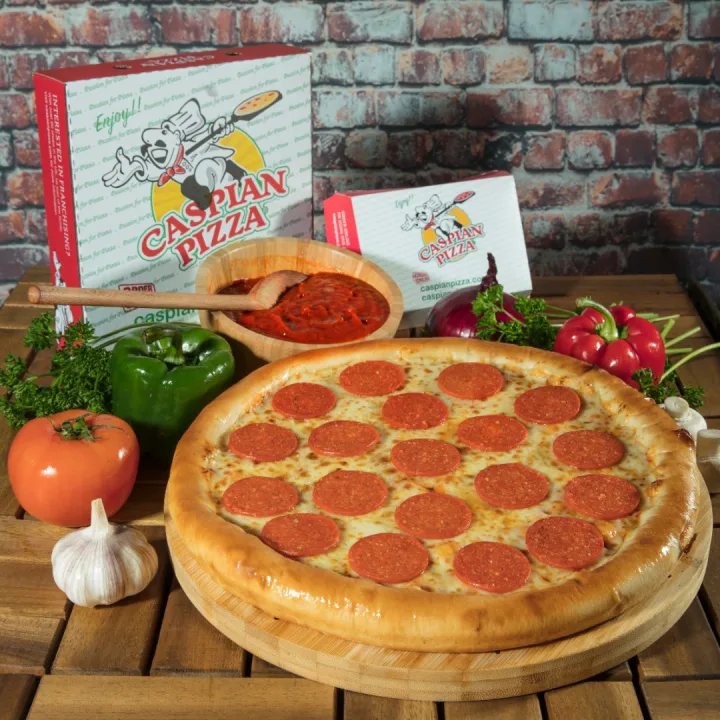 Caspian pepperoni pizza on a wooden board